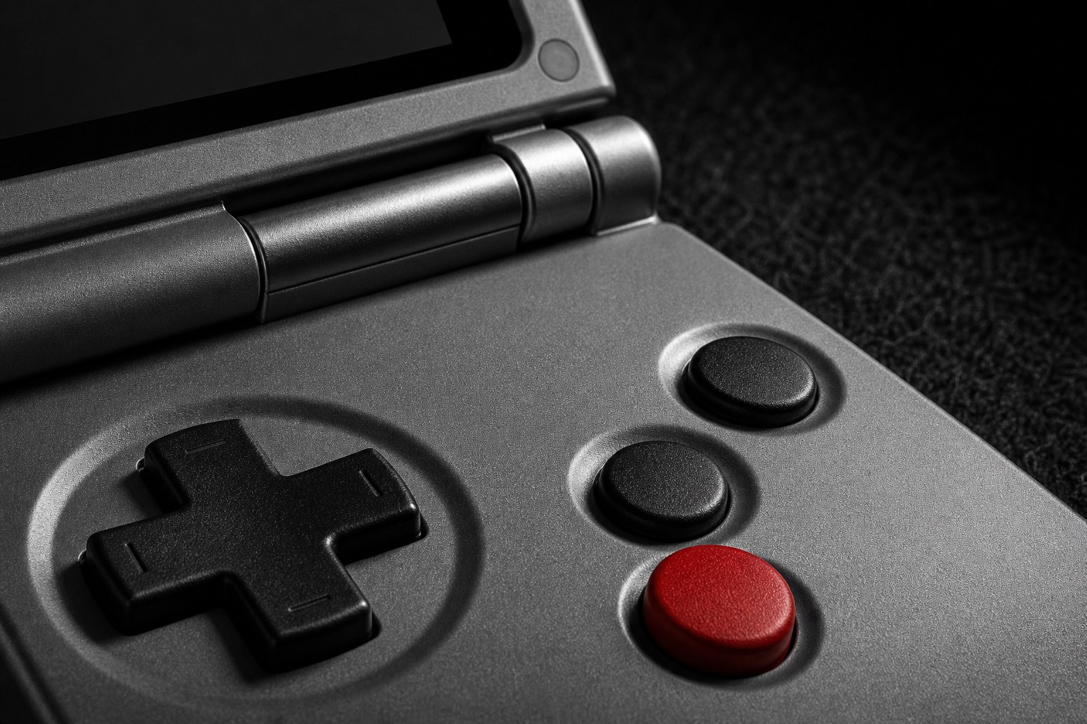 Close macro detail of the Anbernic RG SP redesigned tactile buttons and hinge
