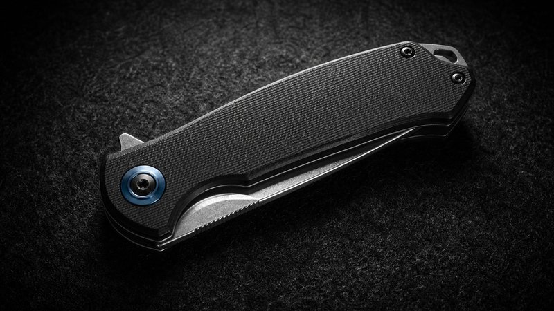 Upgrade knife from an EDC starter kit under $150 in dramatic macro on black felt