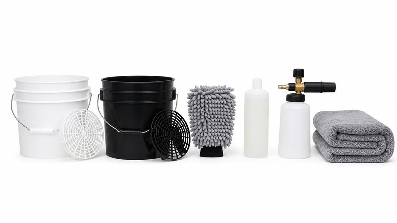 Two bucket wash method equipment in a row: buckets, grit guards, mitt, shampoo, foam cannon, and drying towel